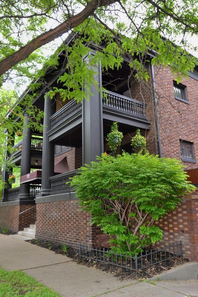 28 Saint Albans St N Unit 4N, Saint Paul, MN 55104 - view of property exterior featuring brick siding and a balcony