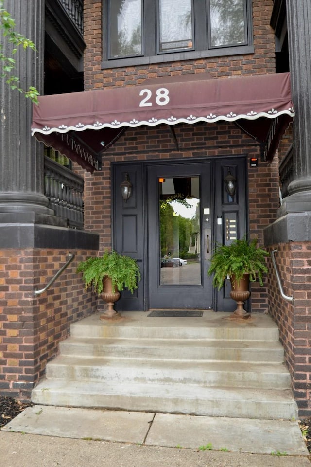 28 Saint Albans St N Unit 4N, Saint Paul, MN 55104 - doorway to property with brick siding
