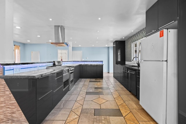 kitchen with appliances with stainless steel finishes, modern cabinets, island exhaust hood, and dark cabinets