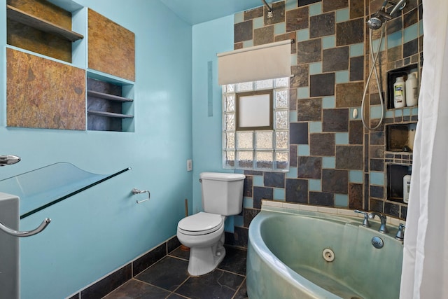 bathroom with a combined bath / shower with jetted tub, baseboards, toilet, and tile patterned floors