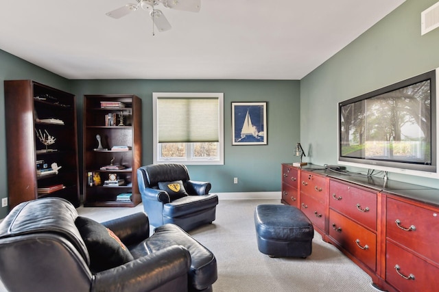 living area featuring a ceiling fan, carpet, visible vents, and baseboards