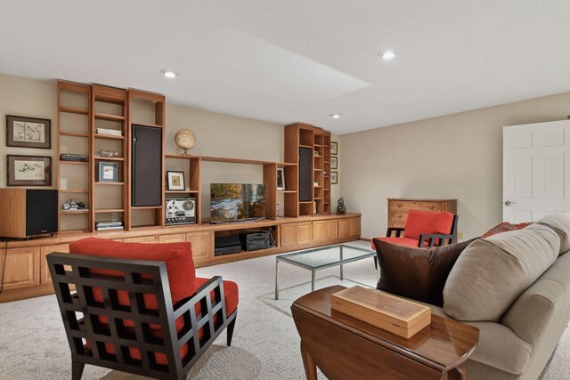 living room with recessed lighting and light colored carpet