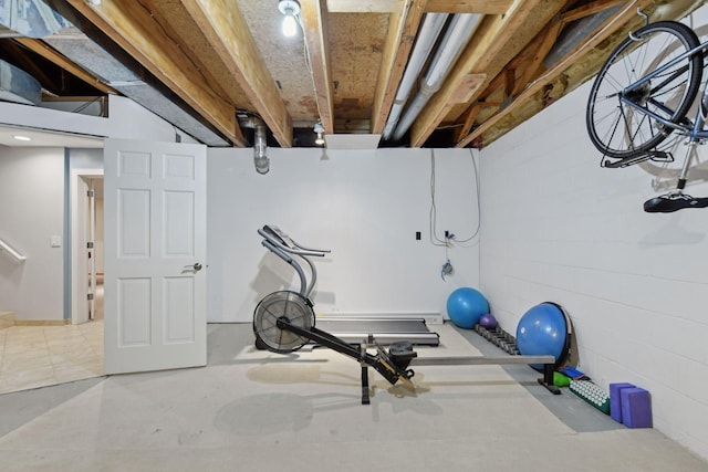 exercise area with concrete block wall