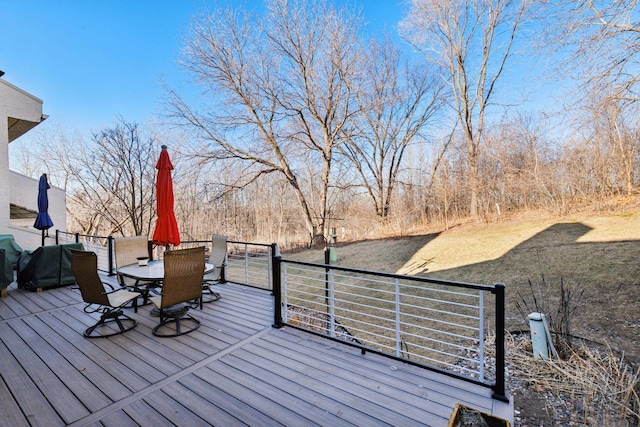 wooden deck featuring outdoor dining space