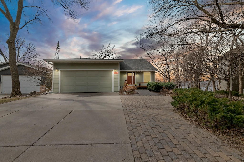 7415 Fernbrook Ln N, Maple Grove, MN 55311 - view of front of house featuring driveway and a garage