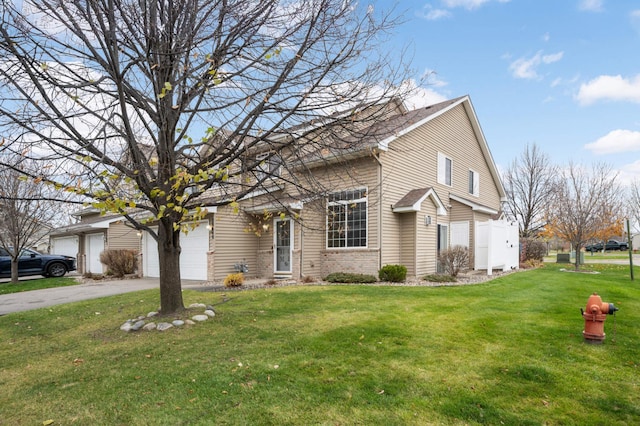 view of front of home with driveway, brick siding, a garage, and a front yard