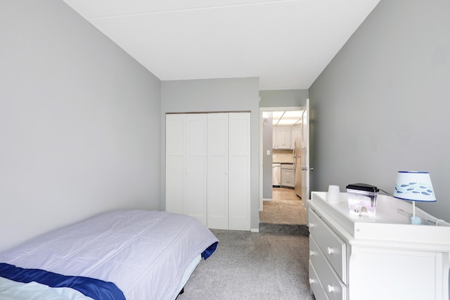 carpeted bedroom featuring a closet