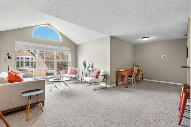 carpeted living area with baseboards, a textured ceiling, and vaulted ceiling