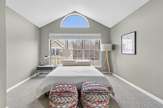 bedroom featuring a textured ceiling, baseboards, lofted ceiling, and carpet