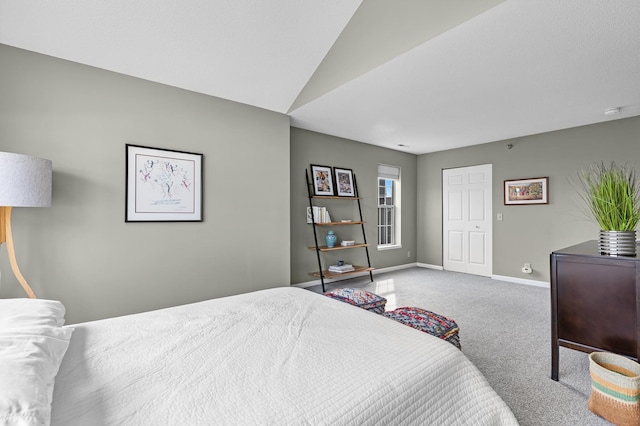 bedroom with carpet flooring and baseboards