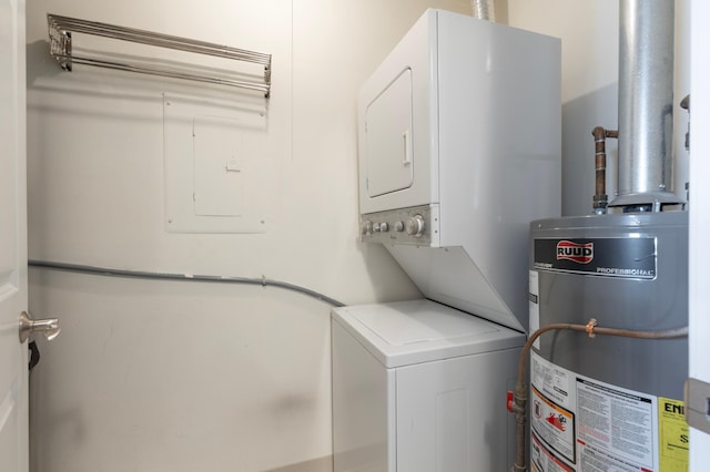 laundry area with gas water heater and stacked washer / drying machine