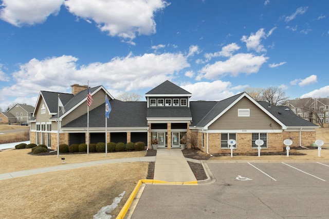 view of property featuring uncovered parking