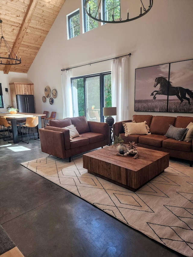 living area featuring concrete flooring, wooden ceiling, beamed ceiling, and high vaulted ceiling