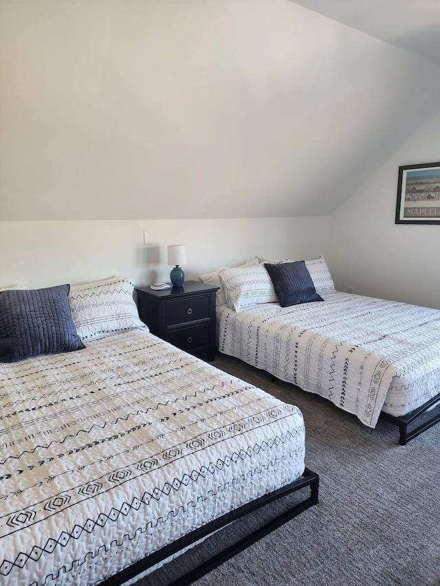 bedroom with carpet and vaulted ceiling