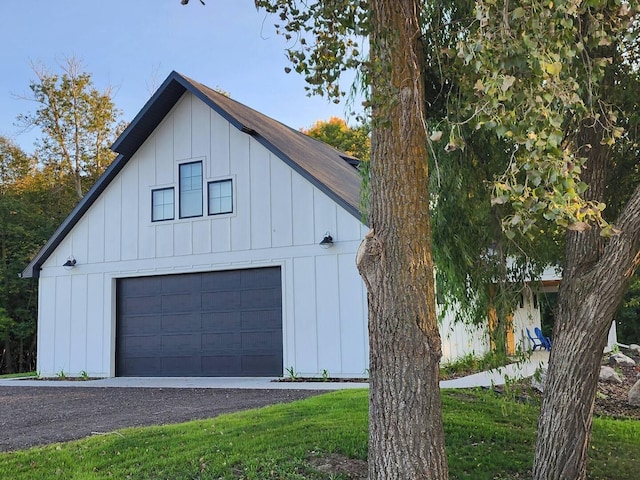 exterior space featuring a detached garage and board and batten siding