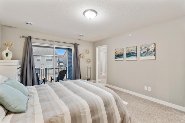 carpeted bedroom featuring a textured ceiling, access to outside, and baseboards