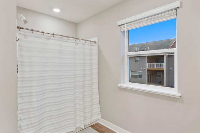 full bath with baseboards