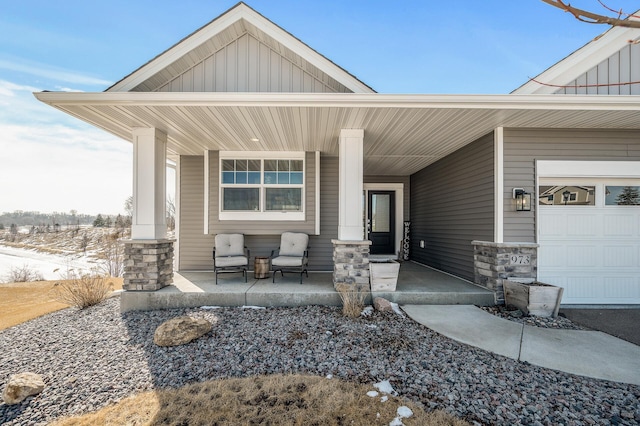 property entrance featuring stone siding, a porch, and board and batten siding