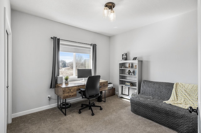 carpeted office space with baseboards