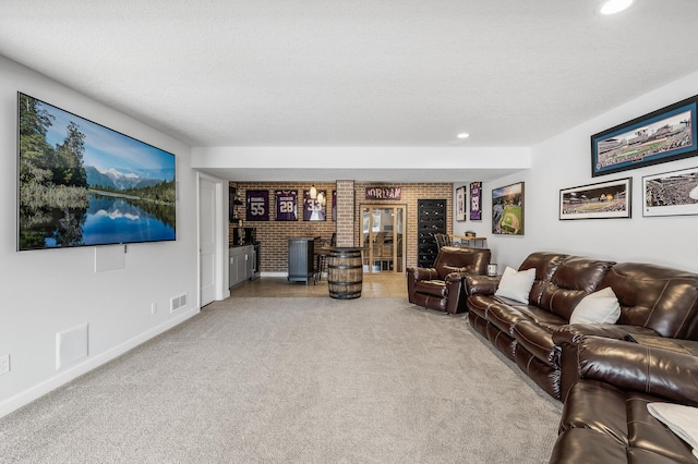 living area with carpet floors, recessed lighting, visible vents, and a textured ceiling