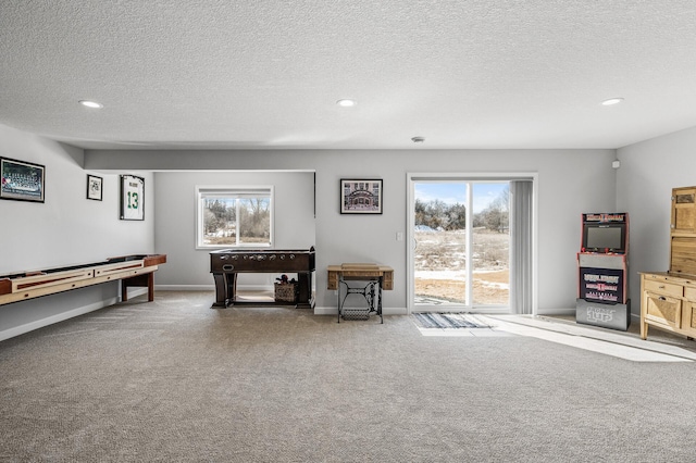 game room with plenty of natural light, baseboards, and carpet flooring