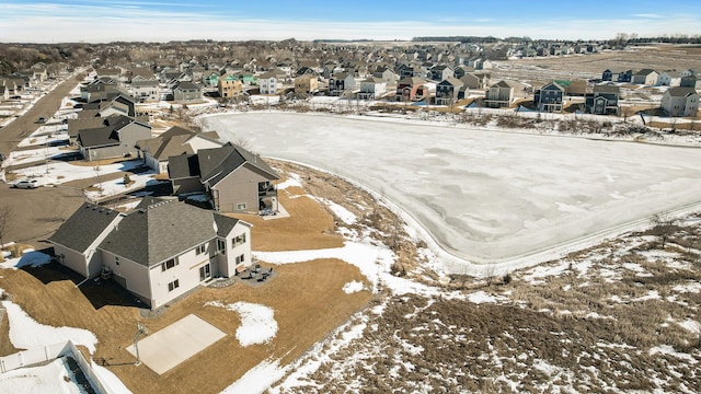 snowy aerial view with a residential view