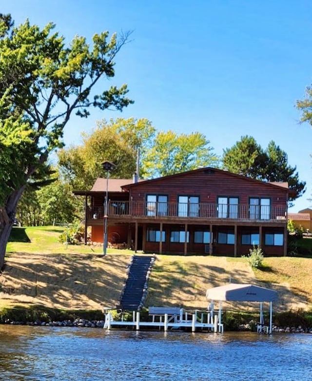 rear view of property featuring a water view