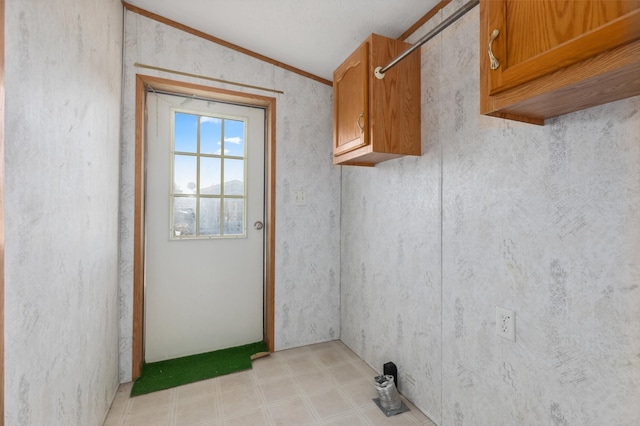 laundry area featuring light floors and golf simulator