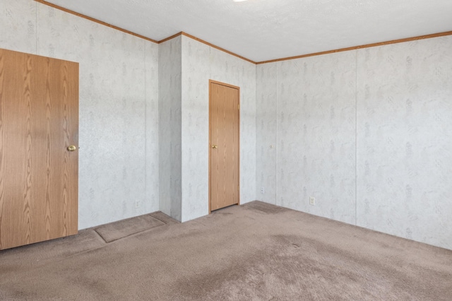 carpeted empty room with ornamental molding