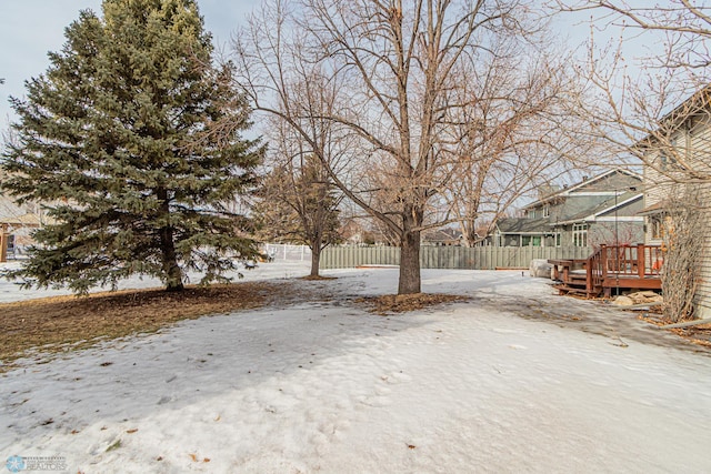 view of yard with fence and a wooden deck