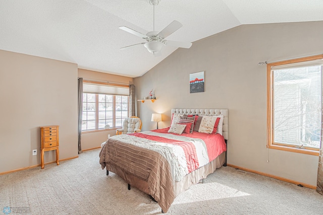 bedroom featuring vaulted ceiling, ceiling fan, baseboards, and light colored carpet