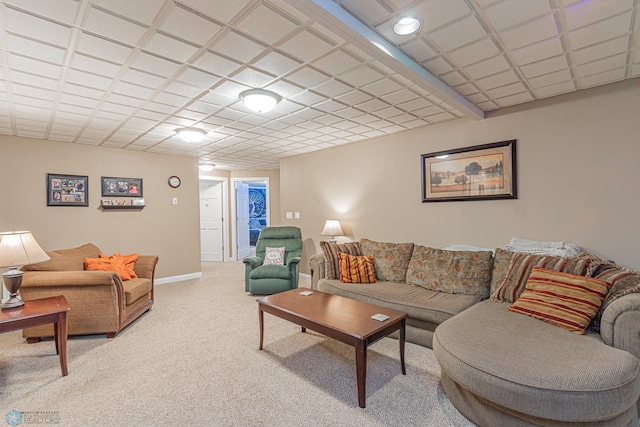 living area with light colored carpet and baseboards