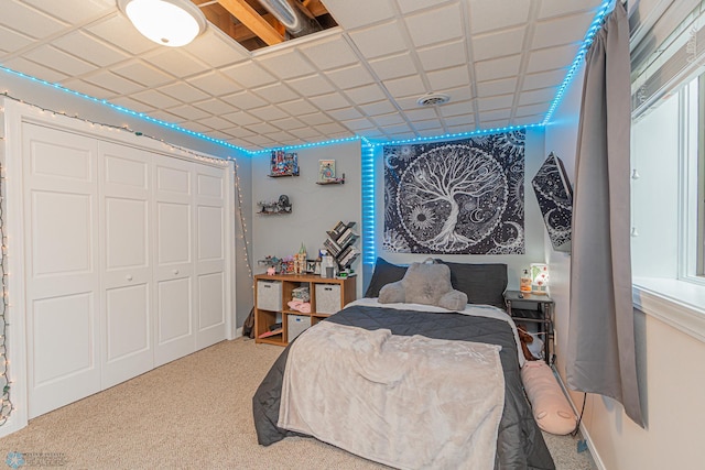 carpeted bedroom with a closet