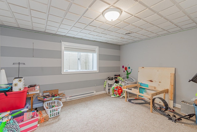 recreation room featuring baseboards and carpet flooring