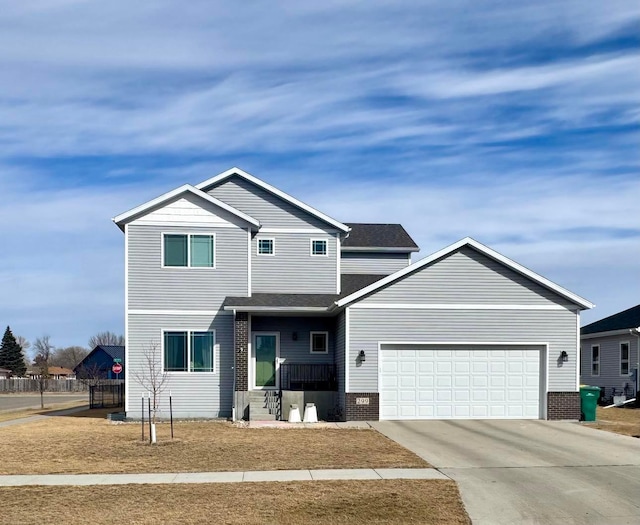 view of front of house featuring brick siding, a garage, and driveway