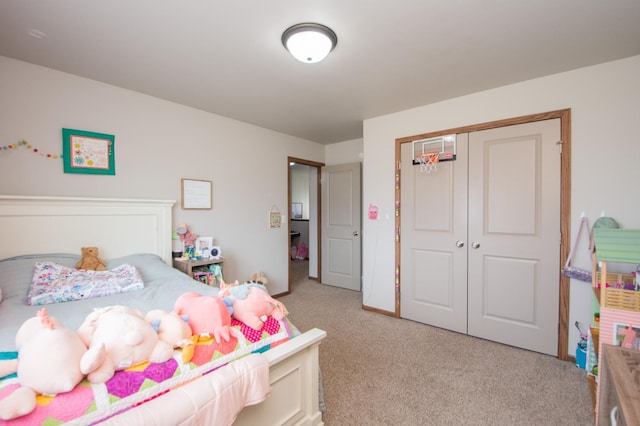 bedroom featuring a closet and light carpet