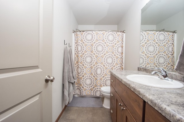 full bathroom featuring vanity and toilet