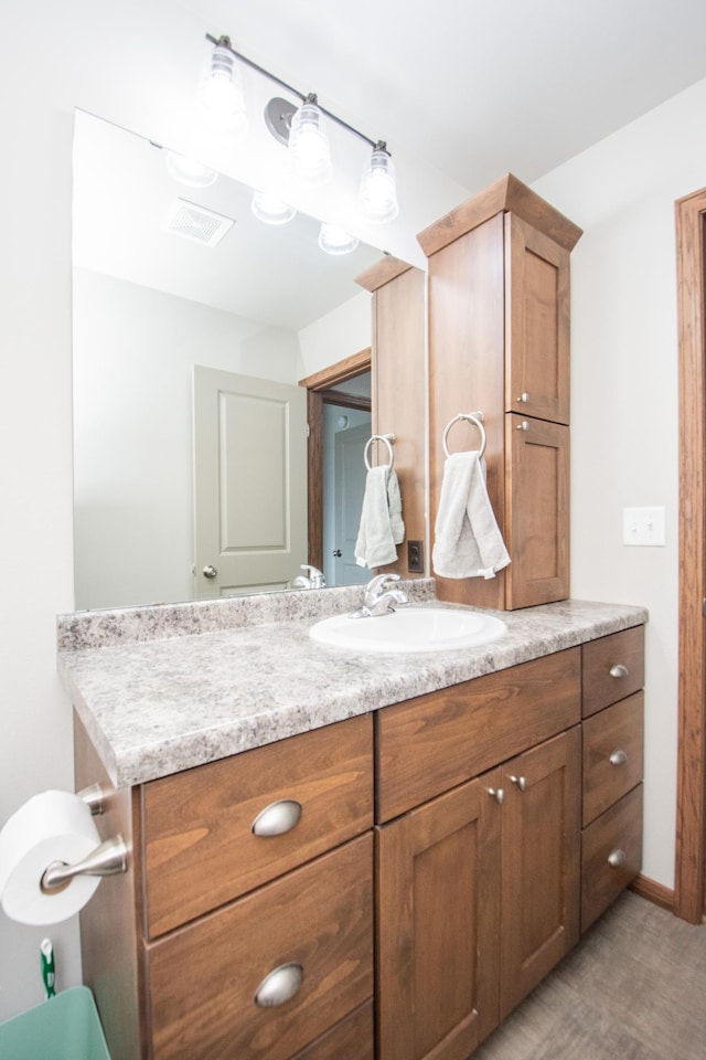 bathroom with visible vents and vanity