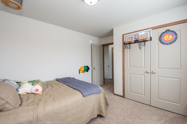 bedroom featuring a closet and carpet