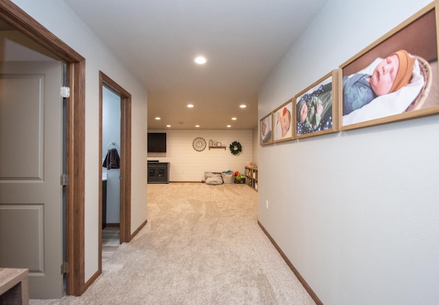 hallway with recessed lighting, carpet flooring, and baseboards