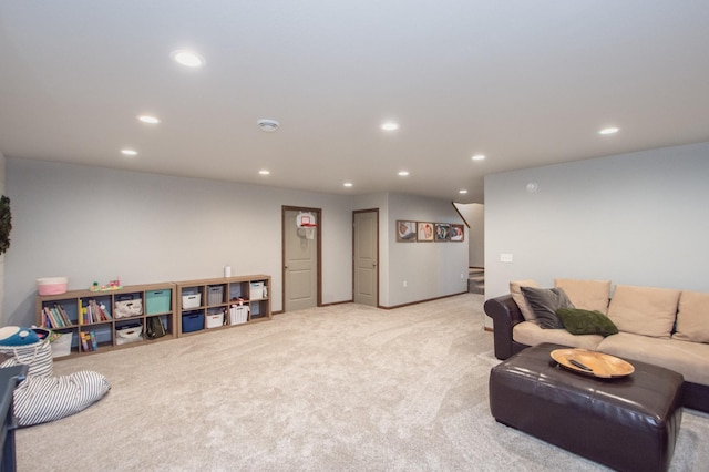 carpeted living area with baseboards, recessed lighting, and stairs