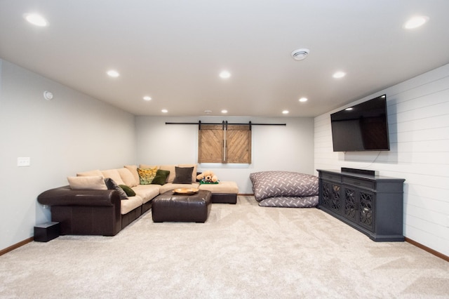 living room featuring carpet, a barn door, and recessed lighting