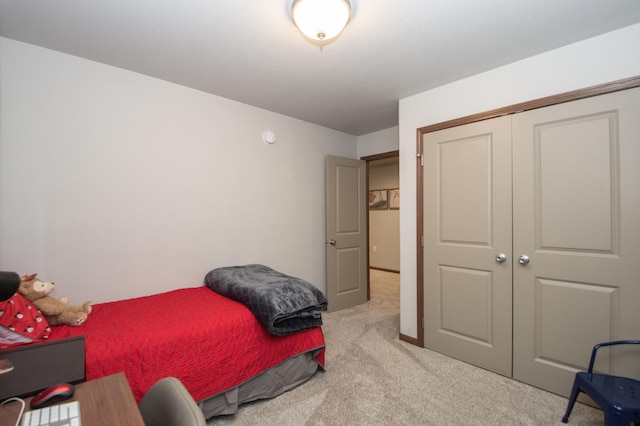 carpeted bedroom with a closet