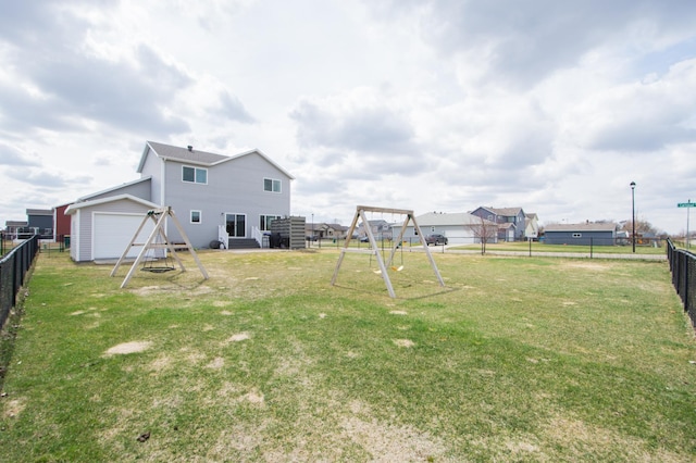 view of yard with a playground and a fenced backyard