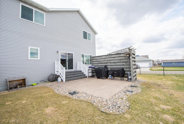 back of property featuring a patio, fence, and a yard
