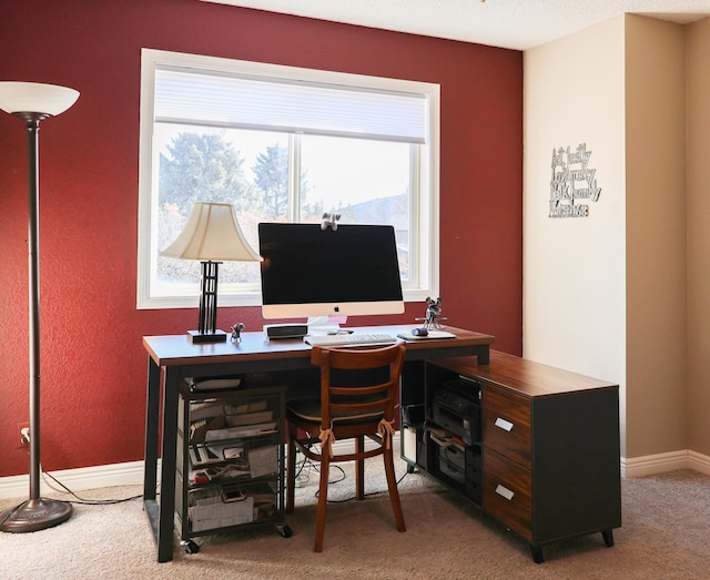 office area featuring light colored carpet and baseboards