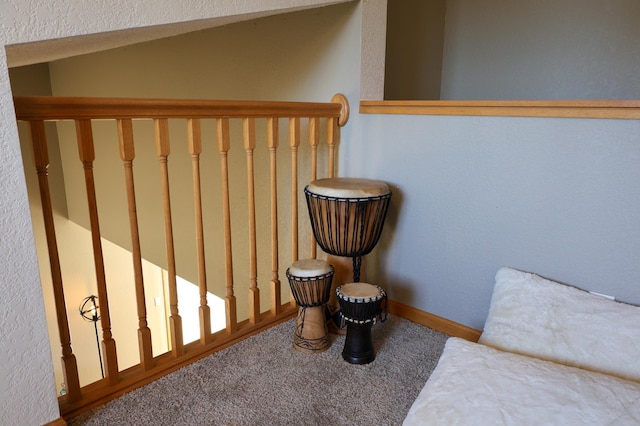 staircase with carpet flooring and baseboards