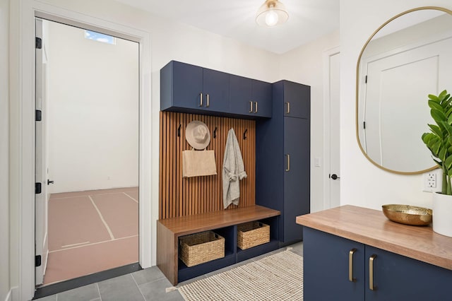 mudroom featuring light tile patterned flooring