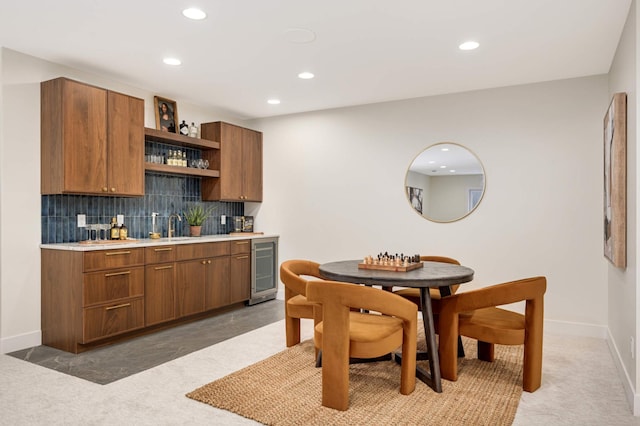 kitchen with beverage cooler, open shelves, recessed lighting, decorative backsplash, and light countertops