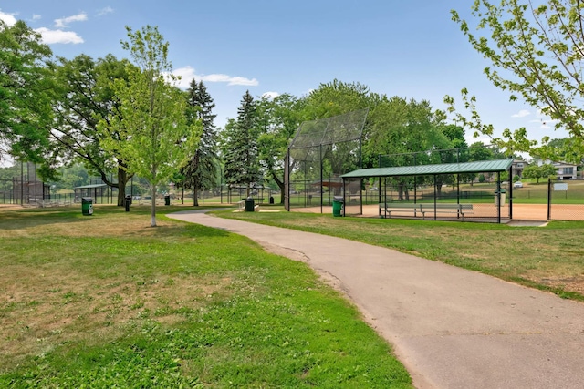 view of community with a yard and fence